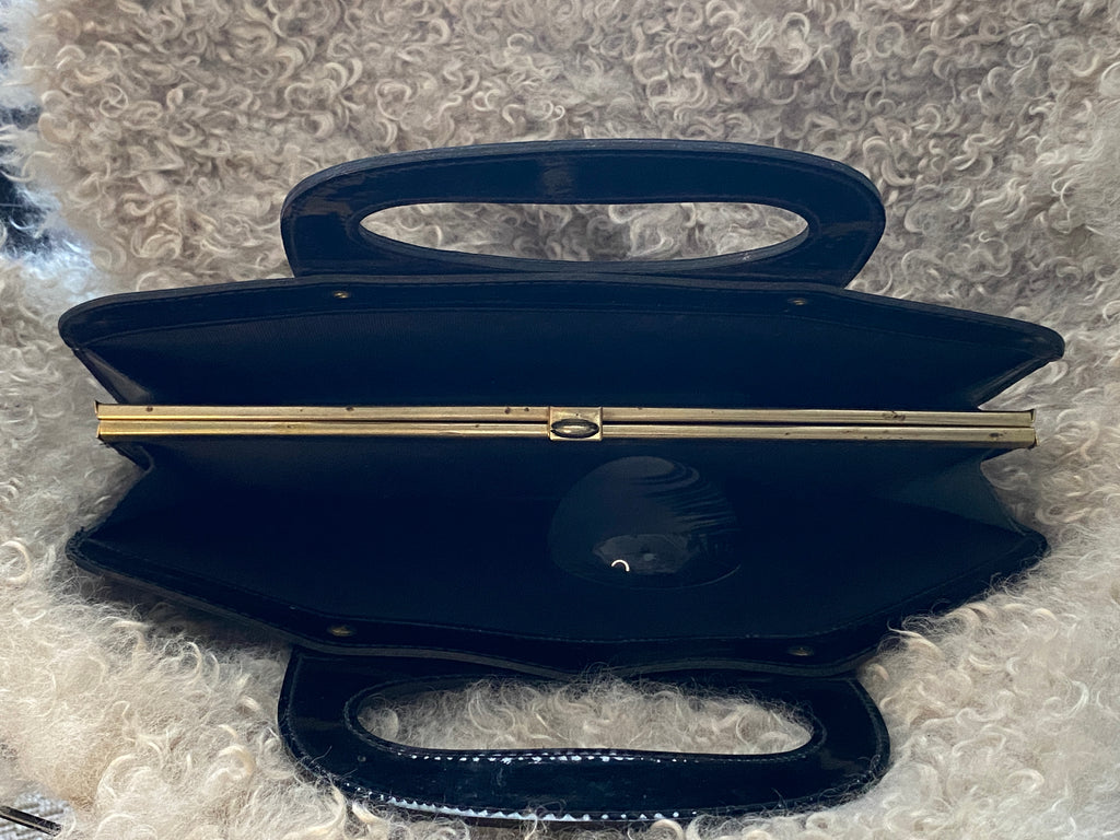 Sac vintage vinyle noir années 60 – vue du dessus – structure rigide