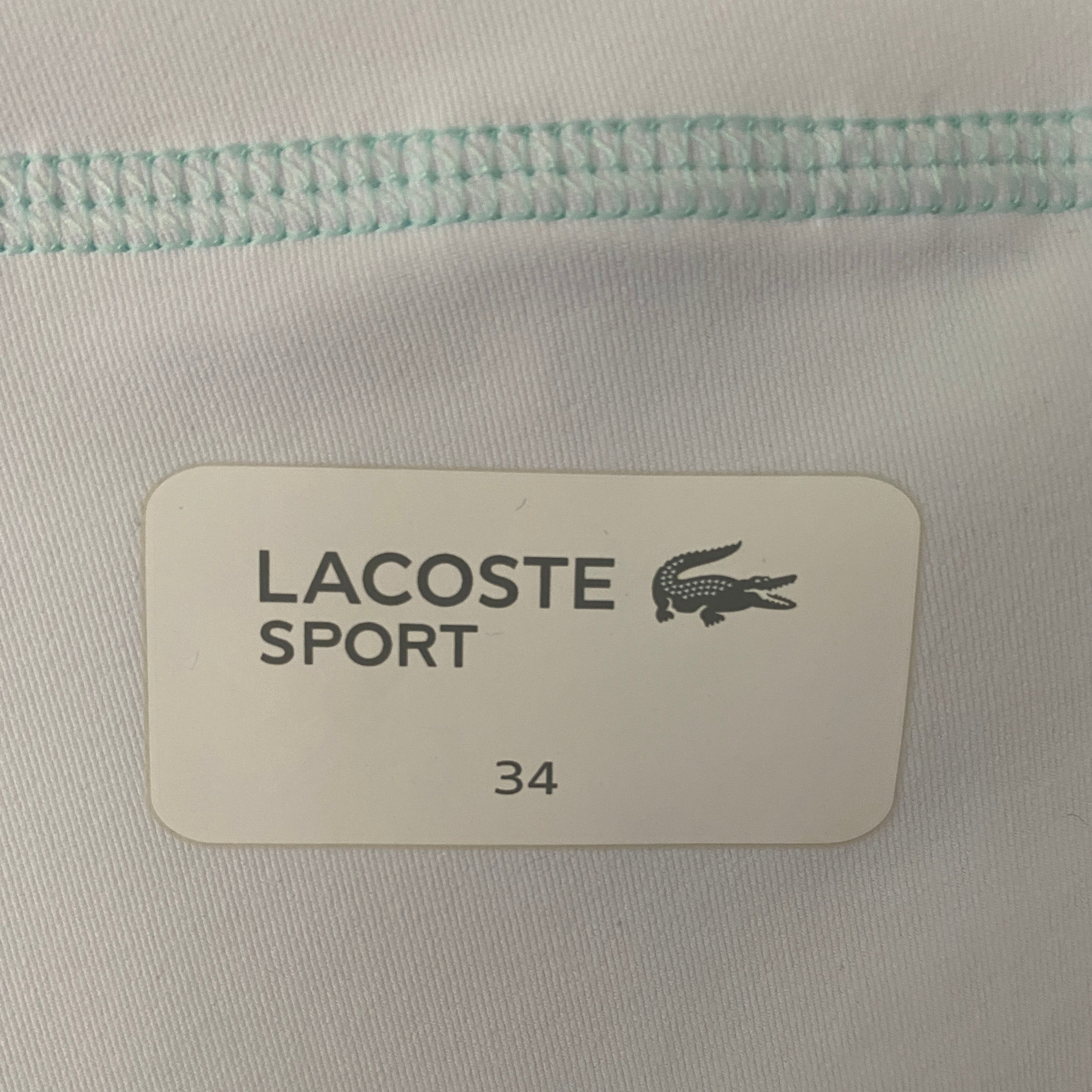 Détail étiquette intérieure Lacoste Sport taille 34