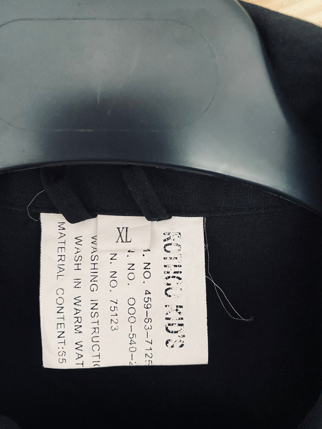 Étiquette composition – 65% polyester 35% coton, instructions entretien – combinaison flight suit noire