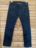 Jean vintage Levi's 501 indigo brut foncé – vue de face globale sur cintre